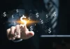 Fyntek connects payment ecosystems at SBC Summit Americas A man touches a dollar sign connected to others, illustrating Fyntek's analysis.