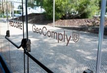 An exit door with GeoComply's branding on it