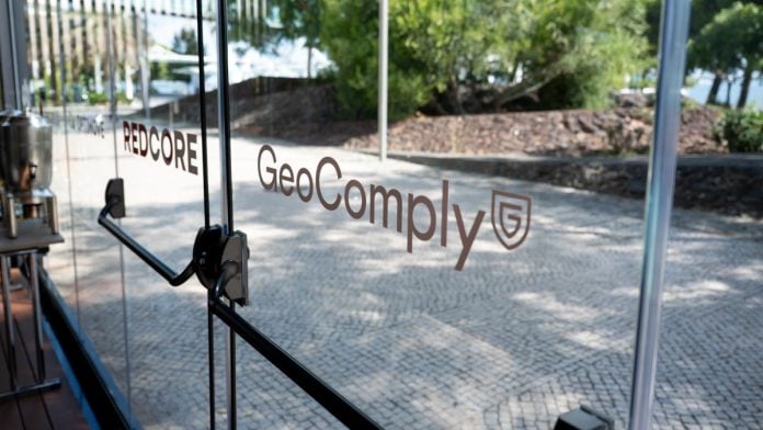 An exit door with GeoComply's branding on it