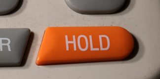 Phone hold logo as FanDuel puts a temporary hold on its per-wager tax in Illinois.