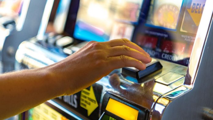 Virginia-Gov.-Spanberger-says-no-to-legalizing-skill-gaming-machines A person playing a gaming machine
