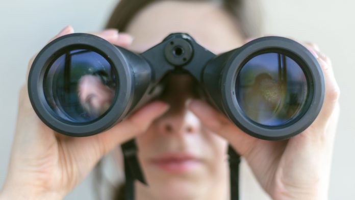 AGA-Gambling-Industry-Outlook-Report A person with binoculars as the AGA shares its latest industry outlook.