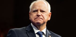 Minnesota Gov. Tim Walz as the CFTC sues the state over a prediction market ban.