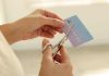 Ohio regulator proposes credit card ban for gaming accounts A person cutting a credit card as Ohio considers a regulatory credit card ban.