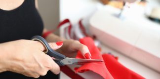 A person cutting as PENN and GDC Group undergo job cuts.