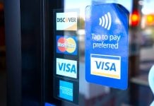 Florida tells payment giants: Stop working with illegal gambling sites Signs for Visa, Mastercard, and American Express on a shop door