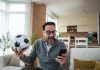 A person watching live sports as New Jersey advances a micro bet ban.