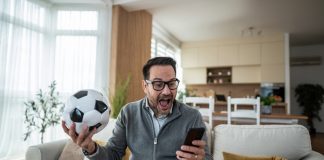 A person watching live sports as New Jersey advances a micro bet ban.