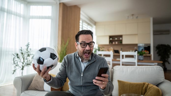 Micro-Bet-Ban-New-Jersey A person watching live sports as New Jersey advances a micro bet ban.