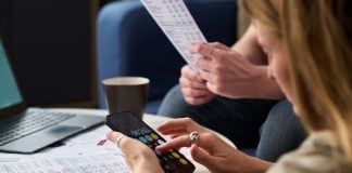 A person looking at statements as NY advances a consumer protection gambling bill.