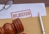Polymarket loses bid for preliminary injunction against Michigan A stamp saying "Rejected" on a document