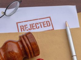 A stamp saying "Rejected" on a document