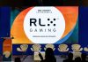 RLX Gaming names ReelPlay as first US online casino aggregation partner The RLX Gaming logo at an SBC event