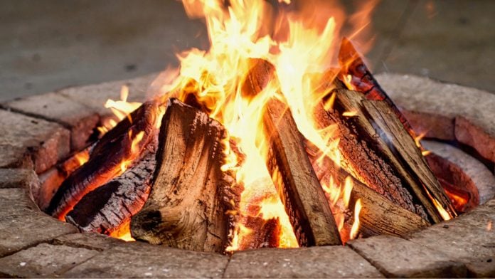 Delware-North-Rebrand-Ember-Entertainment A fire pit as Delaware North rebrands its gaming business to Ember Entertainment.