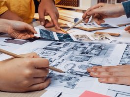People looking at a blueprint sketch