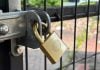 A padlock on a fence