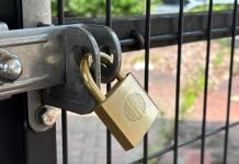 A padlock on a fence