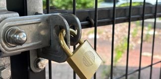 A padlock on a fence