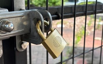 A padlock on a fence