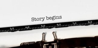 Vintage typewriter on white background with text "story begins"