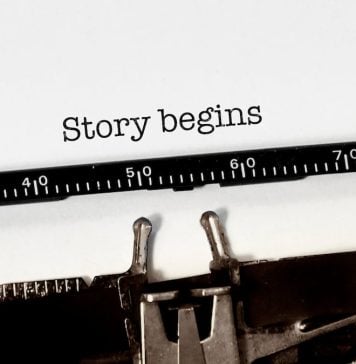 Vintage typewriter on white background with text "story begins"