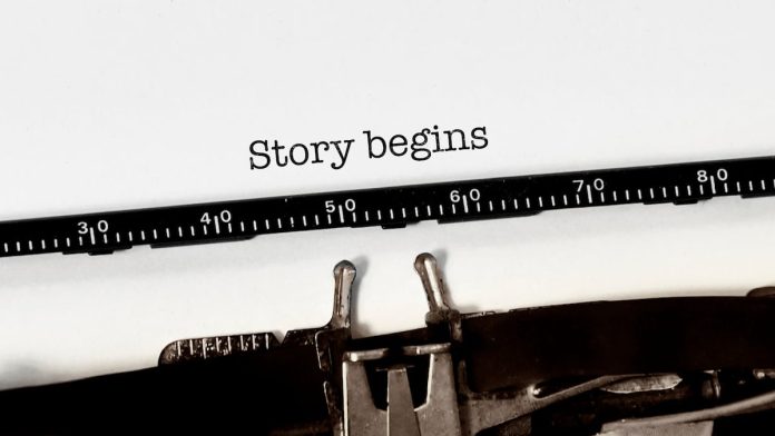 Vintage typewriter on white background with text "story begins"