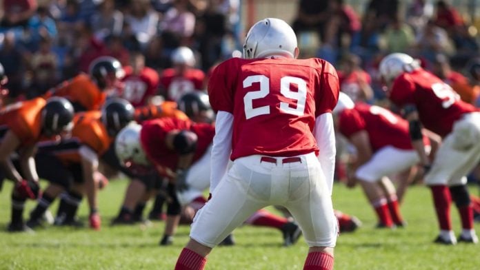 American Football american football game with out of focus players in the background