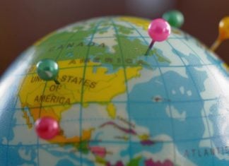 A globe with pins as GeoComply and FanDuel renew their partnership.