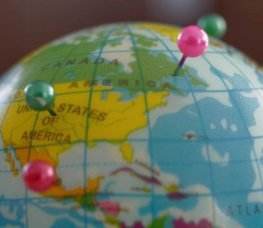 A globe with pins as GeoComply and FanDuel renew their partnership.