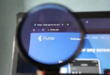 Will FanDuel Predicts catch up to prediction markets rivals? The Flutter logo through a magnifying glass