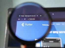 Will FanDuel Predicts catch up to prediction markets rivals? The Flutter logo through a magnifying glass
