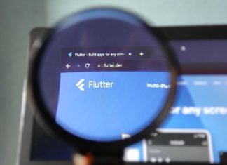 Will FanDuel Predicts catch up to prediction markets rivals? The Flutter logo through a magnifying glass