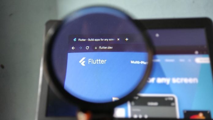 Flutter-execs-FanDuel-worth-more-investment-as-it-looks-to-be-No-1-in-several-verticals The Flutter logo through a magnifying glass