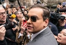 George Santos among a crowd of reporters