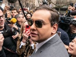 George Santos trades $35,000 to end CFTC probe into Kalshi activity George Santos among a crowd of reporters