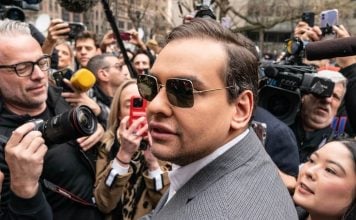 George Santos among a crowd of reporters