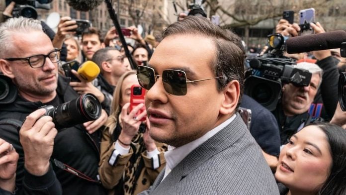 George Santos among a crowd of reporters