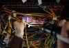 Man working with wires and flash light