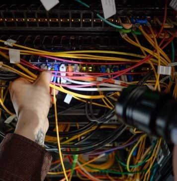 Man working with wires and flash light