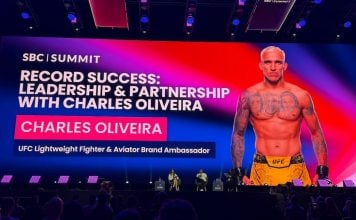 UFC star Charles Oliveira appears on the main stage at SBC Summit in Lisbon