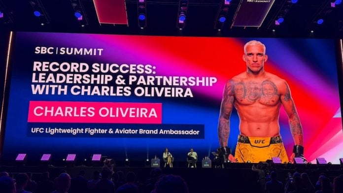 UFC star Charles Oliveira appears on the main stage at SBC Summit in Lisbon