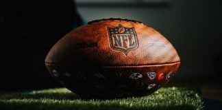 NFL remains strongest skeptic of prediction markets among US leagues NFL football on grass in dark light