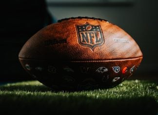 NFL remains strongest skeptic of prediction markets among US leagues NFL football on grass in dark light