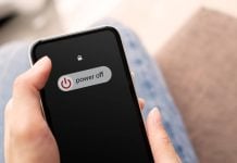 Coinbase agrees to shut down sports prediction markets in Michigan Someone sliding 'power off' on their phone