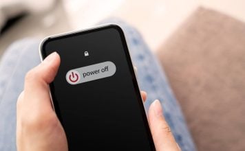 Coinbase agrees to shut down sports prediction markets in Michigan Someone sliding 'power off' on their phone