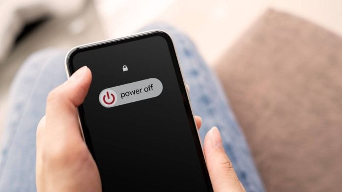 Someone sliding 'power off' on their phone