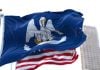 The state flag of Louisiana and the U.S. flag