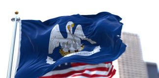 The state flag of Louisiana and the U.S. flag