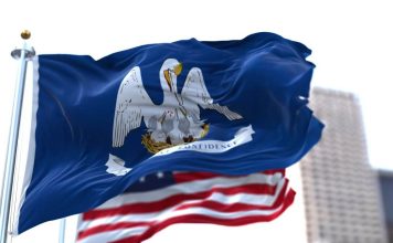 The state flag of Louisiana and the U.S. flag